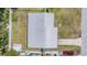 Aerial view of the house showing the roof, driveway, and surrounding yard space at 5111 Eldorado Dr, Tampa, FL 33615
