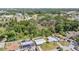Aerial view showcases this lovely property surrounded by lush greenery in a desirable neighborhood at 5111 Eldorado Dr, Tampa, FL 33615