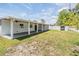 Spacious backyard with covered patio and shed, perfect for outdoor entertaining and relaxation at 5111 Eldorado Dr, Tampa, FL 33615