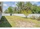 Fenced backyard with well-maintained lawn and storage shed at 5111 Eldorado Dr, Tampa, FL 33615