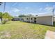 Expansive backyard with a covered patio, ideal for outdoor activities and enjoying the serene surroundings at 5111 Eldorado Dr, Tampa, FL 33615