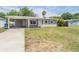 Charming single-story home featuring a covered carport and a well-maintained front yard at 5111 Eldorado Dr, Tampa, FL 33615