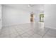 Spacious living room with tile flooring, neutral walls, and a ceiling fan for comfortable living at 5111 Eldorado Dr, Tampa, FL 33615
