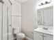 A bathroom with a toilet, sink, and shower at 5119 Gateway Dr, Tampa, FL 33615