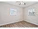 Bedroom featuring new flooring and windows at 5119 Gateway Dr, Tampa, FL 33615
