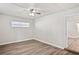 A bedroom with a window and a ceiling fan at 5119 Gateway Dr, Tampa, FL 33615