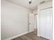 Bright bedroom with wood-look flooring and a closet for ample storage at 5119 Gateway Dr, Tampa, FL 33615