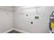 Utility room featuring storage shelves and water heater at 5119 Gateway Dr, Tampa, FL 33615