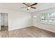 Inviting living room with ceiling fan and new flooring. Bathed in natural light from the front facing window at 5119 Gateway Dr, Tampa, FL 33615