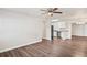 Open-concept living room flowing into the kitchen, featuring new flooring and modern finishes at 5119 Gateway Dr, Tampa, FL 33615