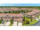 Community aerial view showcasing water feature, lush landscaping, and multiple townhomes at 582 53Rd N Ave, St Petersburg, FL 33703
