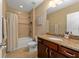 Well-maintained bathroom features a vanity with countertop, tiled shower and bathtub, and neutral wall paint at 582 53Rd N Ave, St Petersburg, FL 33703