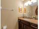 Bathroom with vanity featuring dark wood cabinets and granite countertop with sink at 582 53Rd N Ave, St Petersburg, FL 33703
