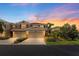 Beautiful exterior of home featuring multi-car garage, well-manicured landscaping, and stunning sunset at 582 53Rd N Ave, St Petersburg, FL 33703
