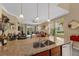 Open-concept living room features large windows, tile flooring, and comfortable seating area at 582 53Rd N Ave, St Petersburg, FL 33703