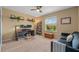 Versatile office space with a work area, comfortable seating, and a window offering natural light at 582 53Rd N Ave, St Petersburg, FL 33703