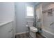 Updated bathroom with modern vanity, updated floors, toilet and combination shower/tub with nautical curtain at 603 Fort Duquesna Dr, Sun City Center, FL 33573