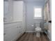 Updated bathroom with modern vanity, updated floors, toilet and combination shower/tub with shower curtain at 603 Fort Duquesna Dr, Sun City Center, FL 33573