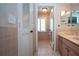 Bathroom featuring a vanity and doorway that leads into the shower and toilet room at 603 Fort Duquesna Dr, Sun City Center, FL 33573