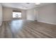 Bright bedroom featuring contemporary floors, a ceiling fan, neutral paint and a view of the neighborhood at 603 Fort Duquesna Dr, Sun City Center, FL 33573