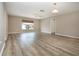 Bright bedroom featuring contemporary floors, a ceiling fan, neutral paint and a view of the neighborhood at 603 Fort Duquesna Dr, Sun City Center, FL 33573