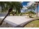 Expansive driveway lined with palm trees and meticulously maintained landscaping at 603 Fort Duquesna Dr, Sun City Center, FL 33573