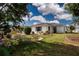 Home exterior with lush landscaping and a well-maintained lawn at 603 Fort Duquesna Dr, Sun City Center, FL 33573