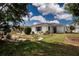 Exterior view of home with well-maintained lawn and mature landscaping at 603 Fort Duquesna Dr, Sun City Center, FL 33573