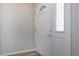 Inviting entryway featuring a white front door with decorative window, adding a touch of elegance at 603 Fort Duquesna Dr, Sun City Center, FL 33573