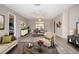 Stylishly furnished living room and dining area with plenty of natural light at 603 Fort Duquesna Dr, Sun City Center, FL 33573