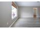 Spacious living room with large window and modern flooring, providing ample natural light at 603 Fort Duquesna Dr, Sun City Center, FL 33573