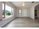 Living room features laminate flooring, neutral walls, and exterior views at 603 Fort Duquesna Dr, Sun City Center, FL 33573
