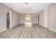 Large living room and dining area, featuring contemporary floors, a ceiling fan, and neutral paint at 603 Fort Duquesna Dr, Sun City Center, FL 33573
