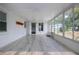 Airy sunroom with neutral tile floor, many windows, and ample natural light at 603 Fort Duquesna Dr, Sun City Center, FL 33573