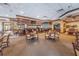 Spacious bar area with ample seating and television for entertainment at 617 Glastonbury Ct, Spring Hill, FL 34609