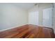Bright bedroom features hardwood floors and a neutral color palette at 617 Glastonbury Ct, Spring Hill, FL 34609
