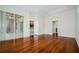 A bedroom featuring wood floors, a large window, and glass patio doors to outside at 617 Glastonbury Ct, Spring Hill, FL 34609