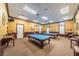 Billiard room with two pool tables and comfortable seating for relaxation at 617 Glastonbury Ct, Spring Hill, FL 34609
