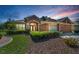 Beautiful single-story home with meticulously maintained landscaping and an attached two-car garage at 617 Glastonbury Ct, Spring Hill, FL 34609