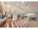 Spacious hall with a stage and tables with chairs at 617 Glastonbury Ct, Spring Hill, FL 34609