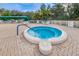 Inviting community hot tub, surrounded by green foliage at 617 Glastonbury Ct, Spring Hill, FL 34609