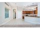 Well-lit kitchen featuring wood cabinets, granite countertops and tile flooring at 617 Glastonbury Ct, Spring Hill, FL 34609