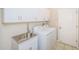 Laundry room with cabinets, sink, and washer/dryer hookups at 617 Glastonbury Ct, Spring Hill, FL 34609