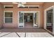Spacious screened patio boasts tile flooring and an open view to the indoors at 617 Glastonbury Ct, Spring Hill, FL 34609