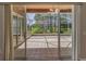 Screened-in patio featuring tile flooring and scenic views of the surrounding landscape at 617 Glastonbury Ct, Spring Hill, FL 34609
