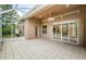 Tiled patio with screen enclosure and ceiling fan at 617 Glastonbury Ct, Spring Hill, FL 34609