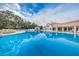 Large community pool offering a relaxing place to cool off at 617 Glastonbury Ct, Spring Hill, FL 34609