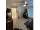 Spacious bedroom with tile flooring, a ceiling fan, and a large closet at 641 N Garden Ave, Clearwater, FL 33755