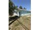 View of a single-story home with a front porch and tidy lawn at 641 N Garden Ave, Clearwater, FL 33755