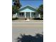 Inviting single-story home with a lovely front porch and attractive blue exterior at 641 N Garden Ave, Clearwater, FL 33755